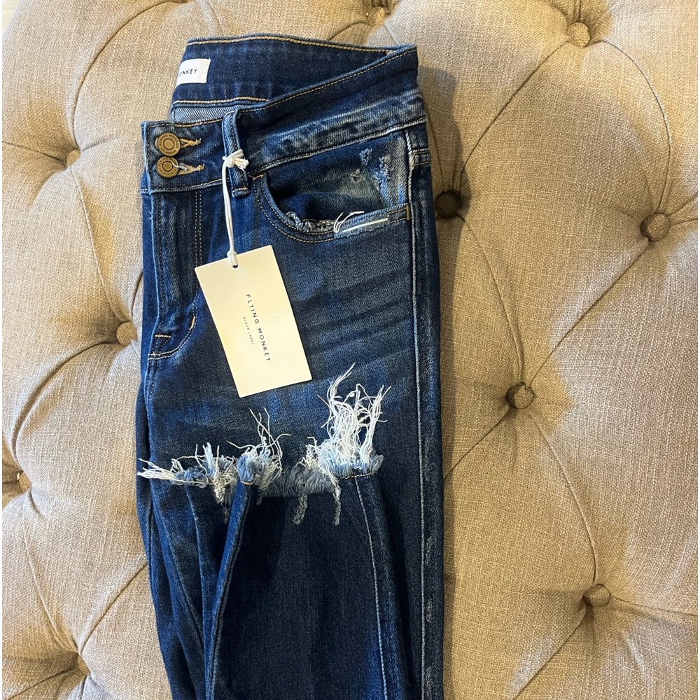 Flying monkey, jeans, distressed at the bottom
